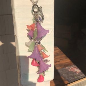 Butterfly Necklace with Silver, Blue, White, Purple, Clear beads on chain link.